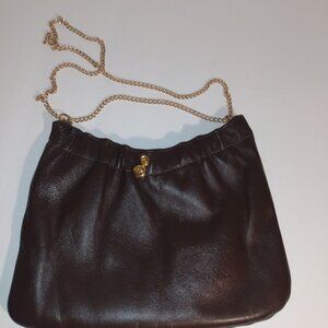 Andre': Vintage brown leather shoulder bag with gold tone chain strap.